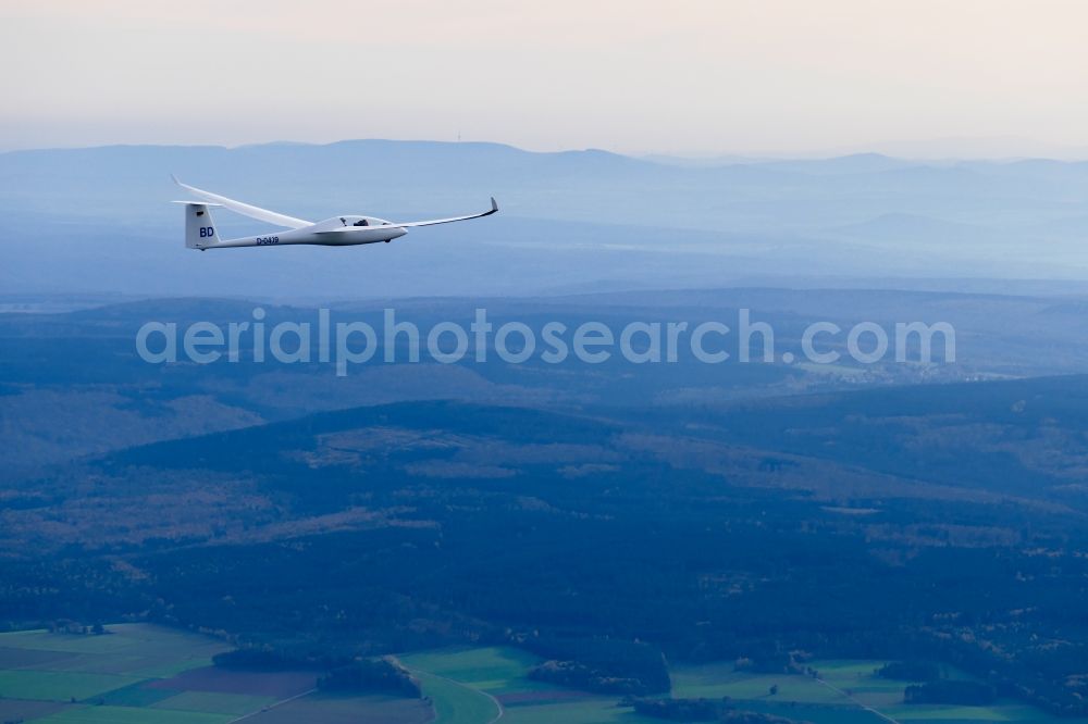 Halle from above - Glider and sport aircraft Duo Discus flying over the airspace in Halle in the state Lower Saxony, Germany