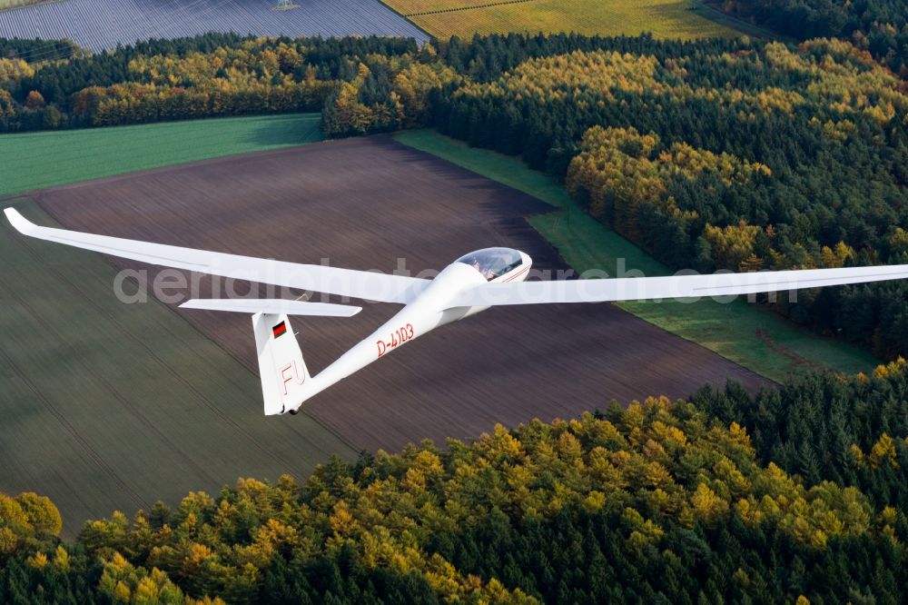 Aerial photograph Dollern - Glider and sport aircraft LS4 D-4103 flying over over the autumn fields and trees near Dollern in the state of Lower Saxony, Germany. This type of glider has been used for many years to train young pilots