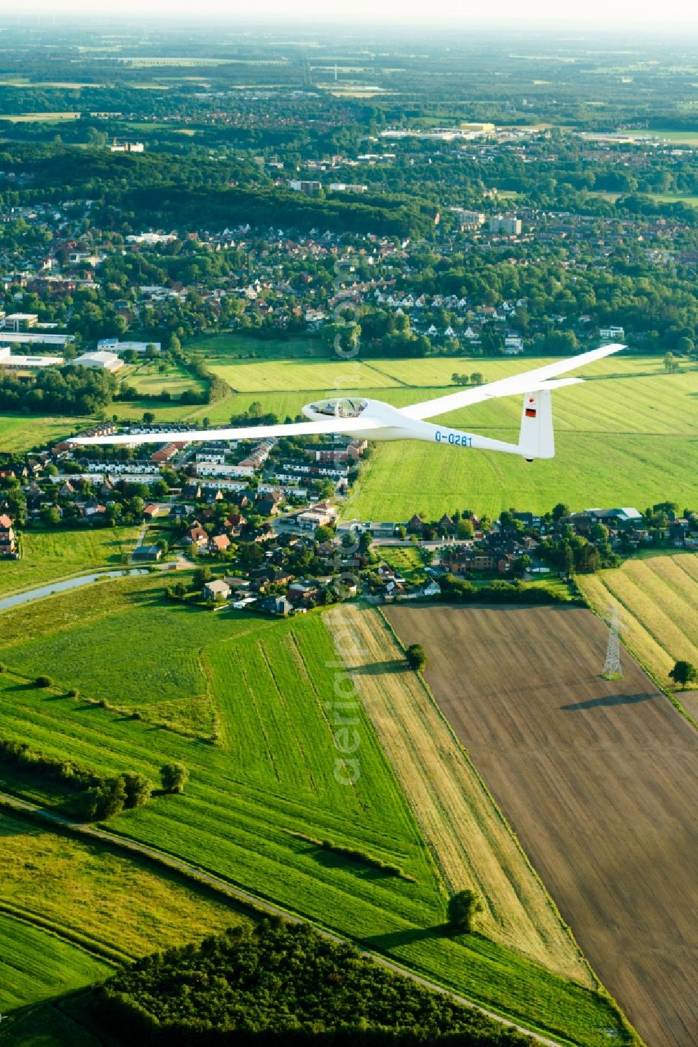 Stade from the bird's eye view: Glider and sport aircraft Glasfluegel Kestrel flying over the airspace in Stade in the state Lower Saxony, Germany