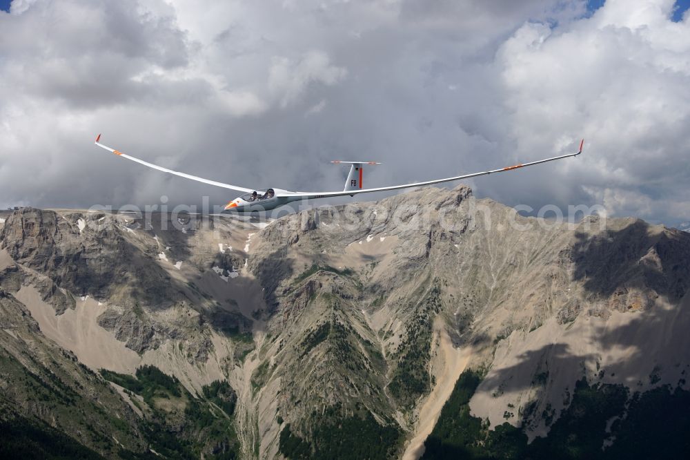 Aerial image Montmaur - Glider EB28 D-KQWB in flight over the mountain Pic de Bure at Montmaur in Provence-Alpes-Cote d'Azur, France. The EB 28 is a double-seated glider of the open class