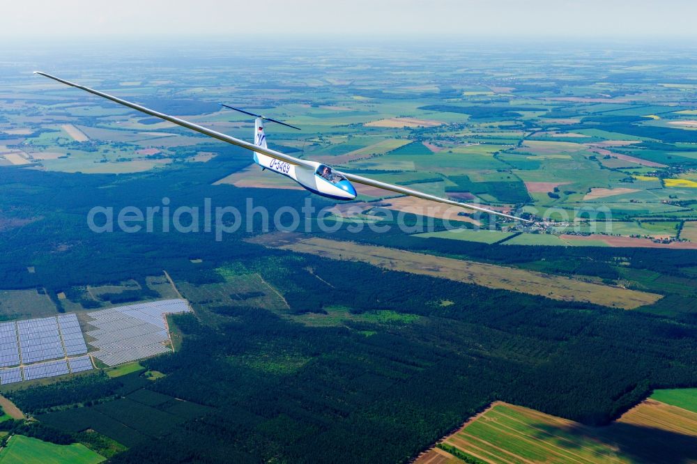 Marienfließ from above - Glider and sport aircraft SZD-36 Cobra flying over the airspace in Marienfliess in the state Brandenburg, Germany