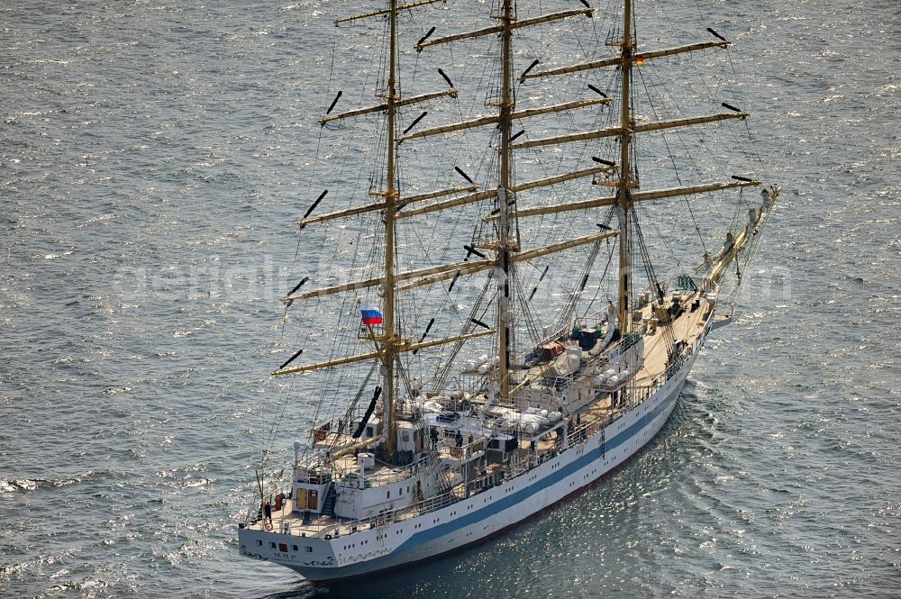 Aerial photograph Rostock - View of the training ship MIR in the Baltic Sea off Rostock in Mecklenburg Western Pomerania. It is owned by the Admiral Makarov Academy in Saint Petersburg, was built in the Lenin shipyard in Danzig and is considered one of the fastest tall ships in the world