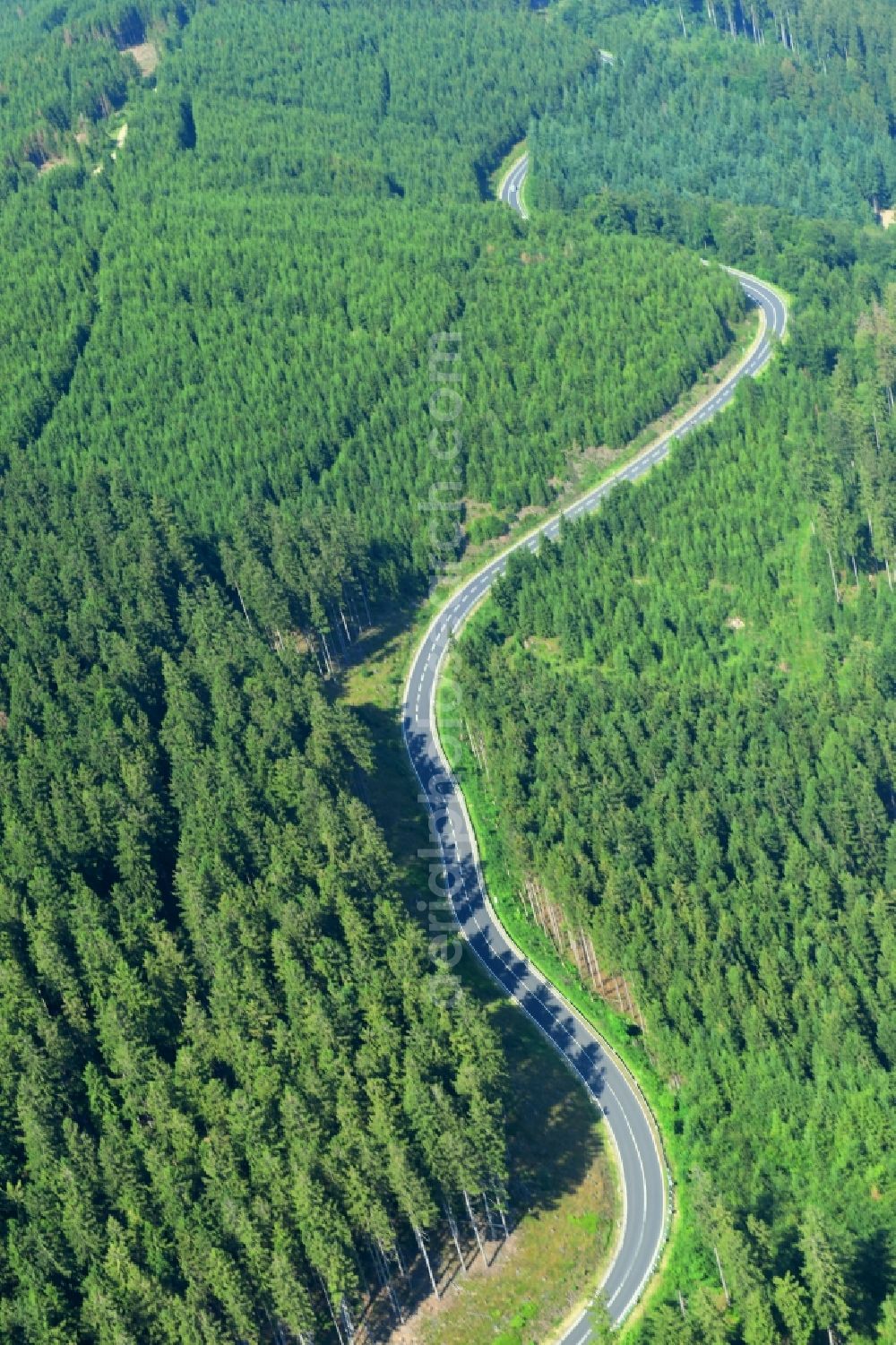 Hahnenklee from above - Serpentine-shaped curve of a road guide Bundesstrasse B 241 in Wald in Hahnenklee in the state Lower Saxony, Germany