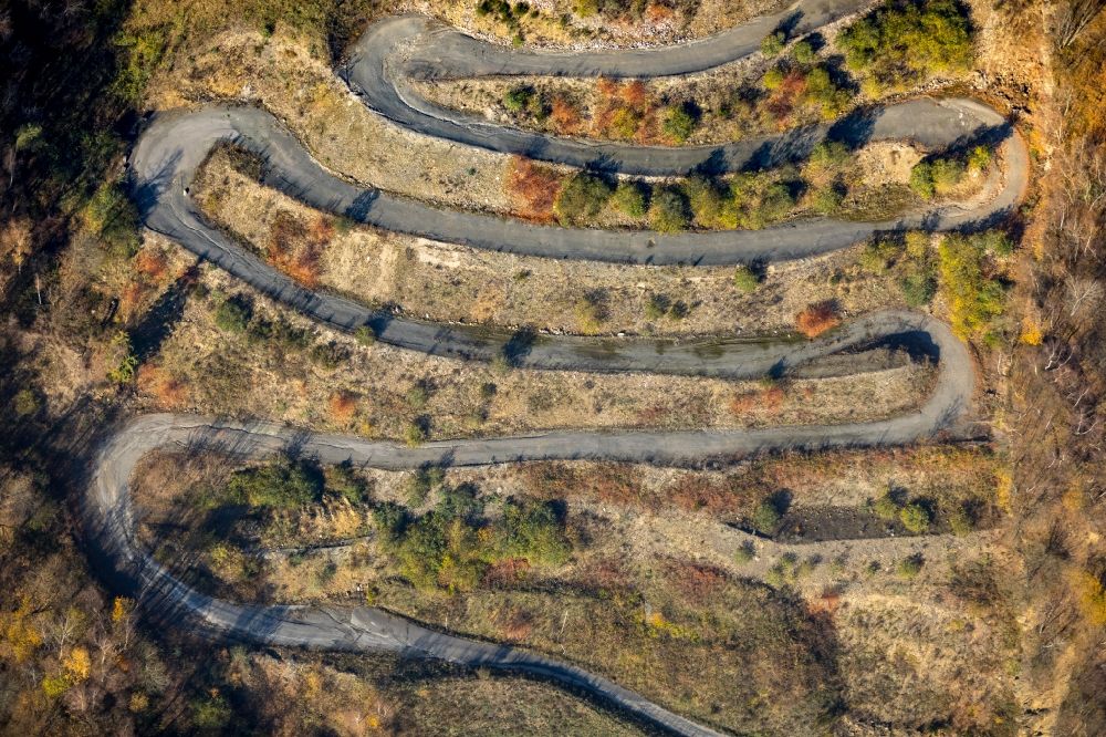 Dümmlinghausen from above - Serpentine-shaped curve of a road guide in Duemmlinghausen in the state North Rhine-Westphalia, Germany