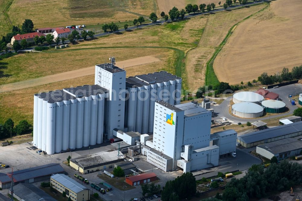 Herzberg (Elster) from above - High silo and grain storage with adjacent storage and animal feed factory in Herzberg (Elster) in the state Brandenburg, Germany