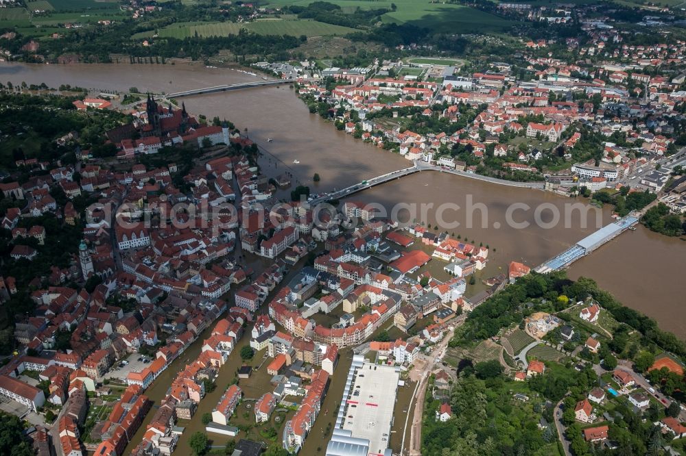 Meißen from the bird's eye view: The situation during the flooding in East Germany on the bank of the river Elbe in the city centre of Meißen in the free state of Saxony. Affected by the high water and flooding are historical buildings of the historic centre and the Gothic Meissen Cathedral