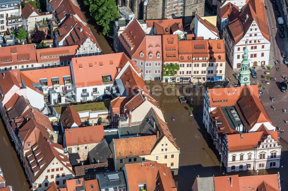 Pirna from above - The situation during the flooding in East Germany on the bank of the river Elbe in the city centre of Pirna in the administrative district Sächsische Schweiz-Osterzgebirge in the free state of Saxony. Affected by the high water and flooding are historical buildings of the historic centre and the Marienkirche