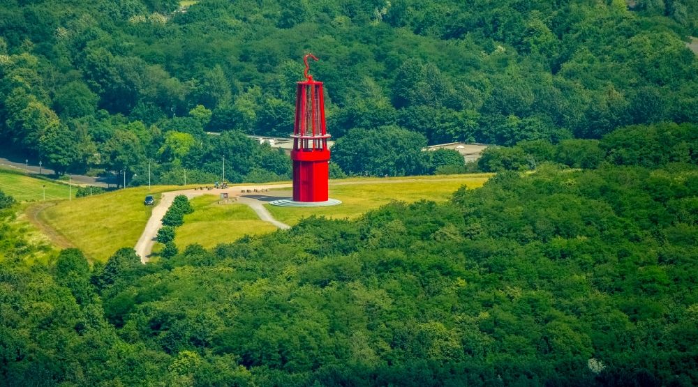 Moers from the bird's eye view: Sculpture of an oversized red miner's lamp on the grounds of renatured Halde Rheinpreussen in Moers in North Rhine-Westphalia