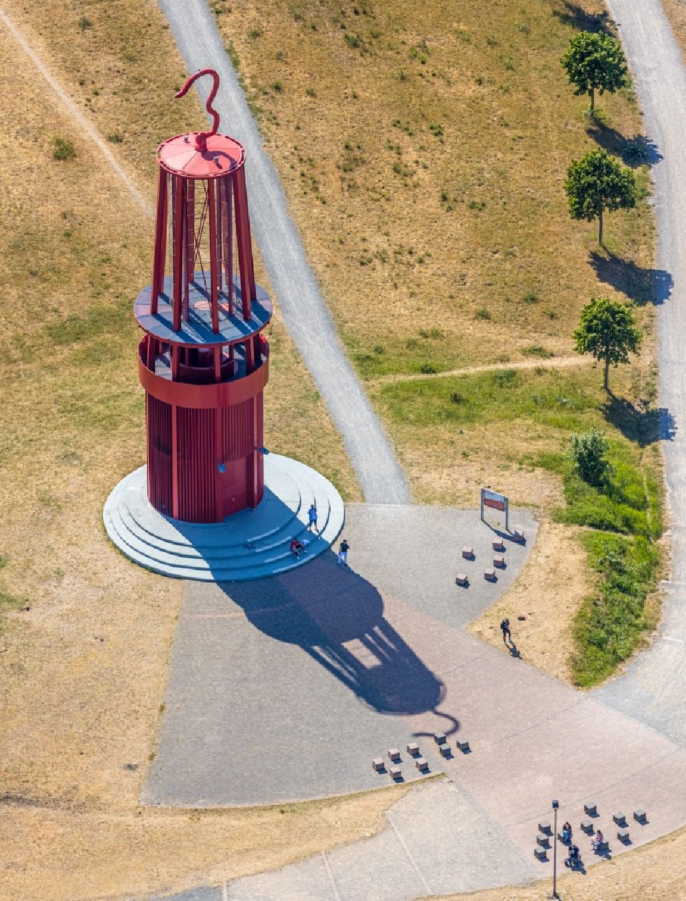 Aerial photograph Moers - Sculpture of an oversized red miner's lamp on the grounds of renatured Halde Rheinpreussen in Moers in North Rhine-Westphalia