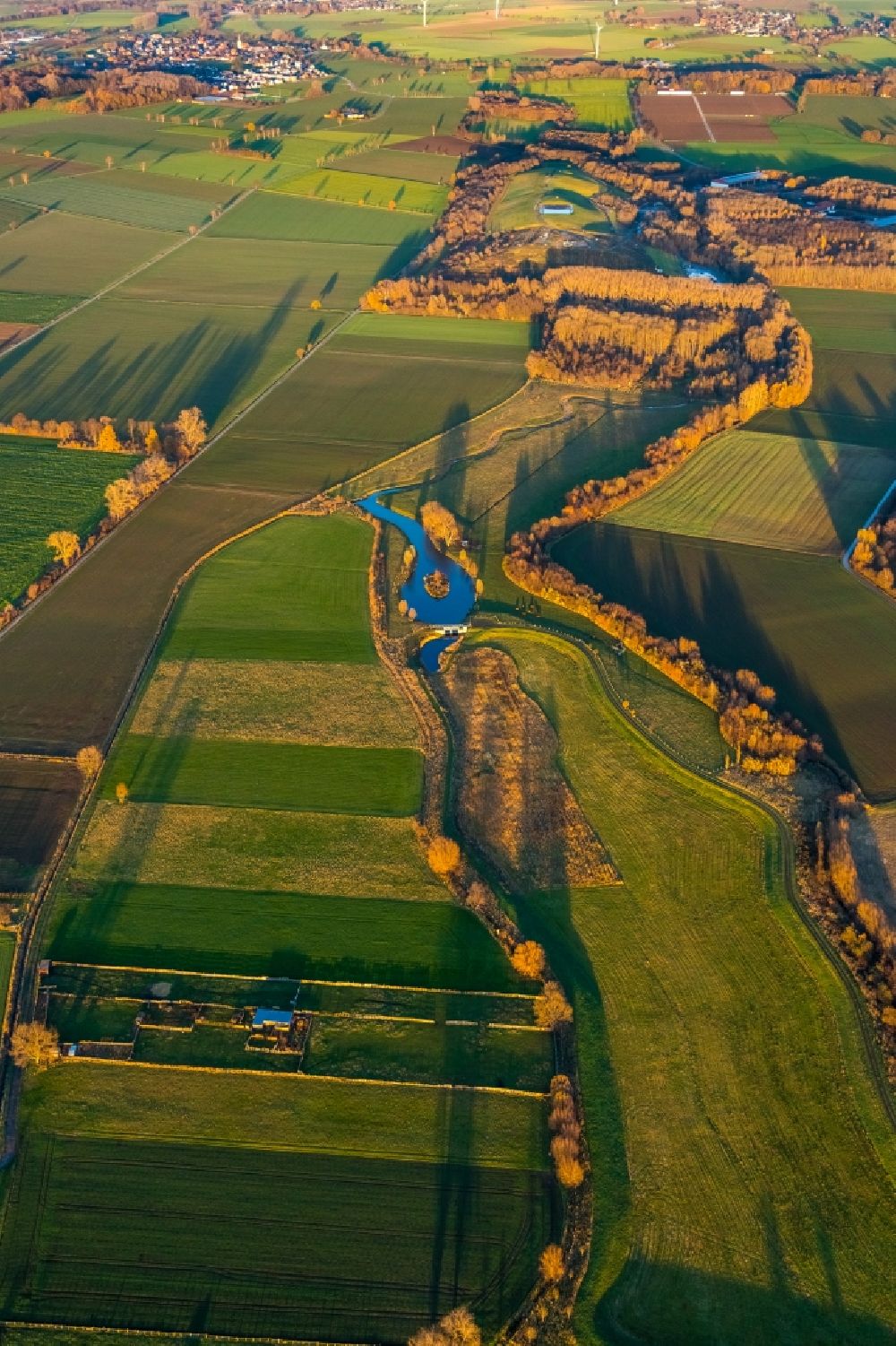 Werl from above - Aerial view of autumn landscape with Soennerbach and Salzbach and pond in Werl in the German state North Rhine-Westphalia, Germany