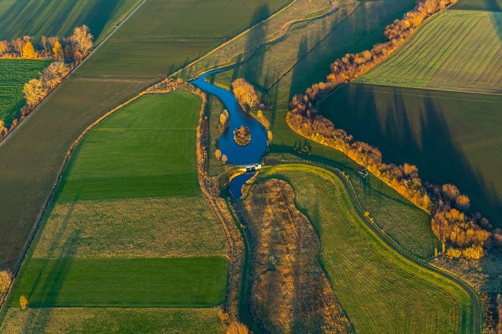 Werl from the bird's eye view: Aerial view of autumn landscape with Soennerbach and Salzbach and pond in Werl in the German state North Rhine-Westphalia, Germany