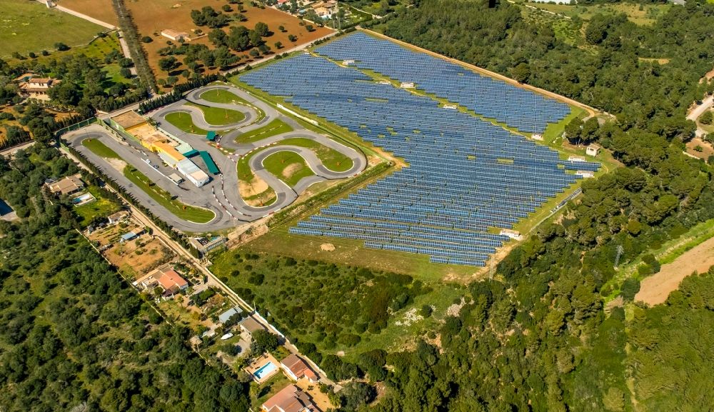 Aerial image Can Picafort - Solar power plant and photovoltaic systems and Go-Kart- Bahn in Can Picafort in Balearic island of Mallorca, Spain