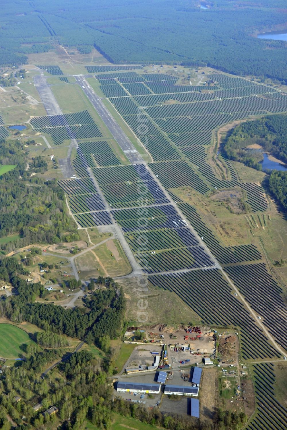 Eberswalde from above - View of the almost fully assembled solar fields of the new solar power plant Finow Tower. The hybrid solar AG is currently building on the former military airport, a solar power plant