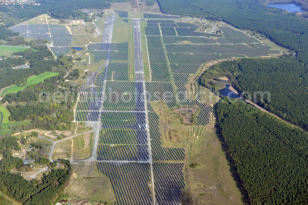 Aerial photograph Eberswalde - View of the almost fully assembled solar fields of the new solar power plant Finow Tower. The hybrid solar AG is currently building on the former military airport, a solar power plant