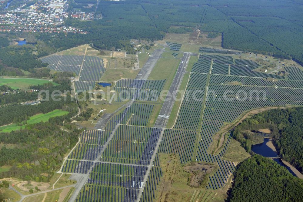 Eberswalde from the bird's eye view: View of the almost fully assembled solar fields of the new solar power plant Finow Tower. The hybrid solar AG is currently building on the former military airport, a solar power plant