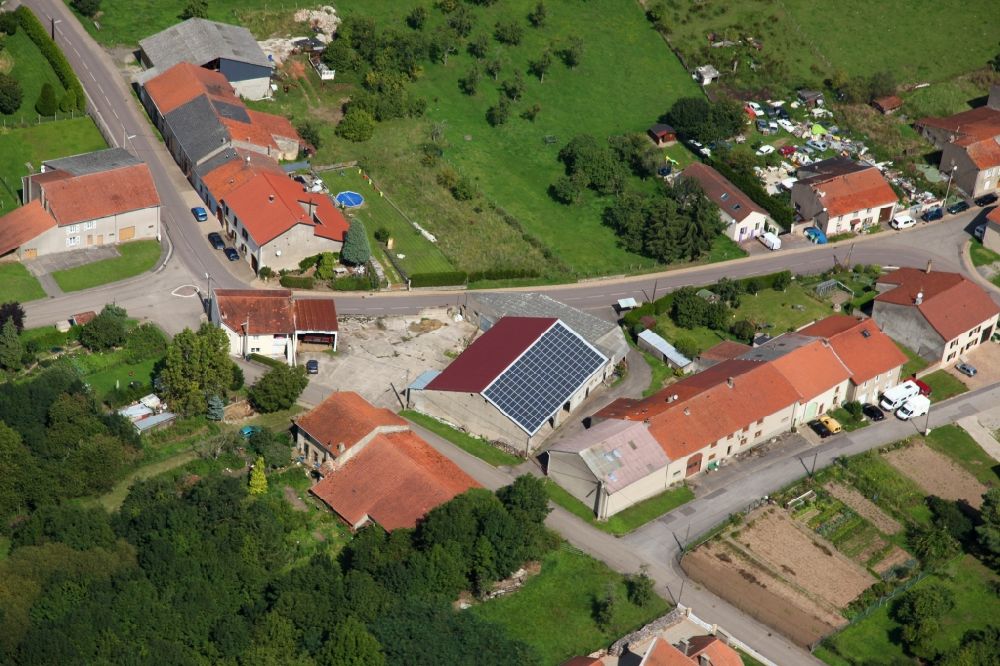 Piblange from the bird's eye view: Solar power plant and photovoltaic system on the roof of a barn in Piblange in Grand Est, France