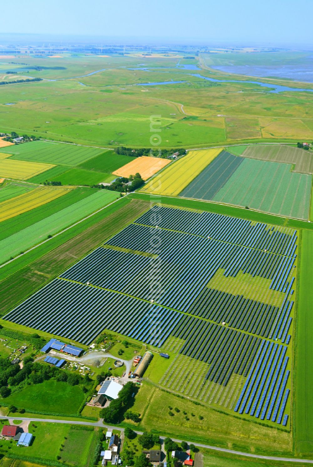 Aerial image Busenwurth - Panel rows of a solar power plant and photovoltaic system of the PV Betriebs Waste to Energy A UG & Co. KG in a field on the Alte Landstrasse in Busenwurth in the state Schleswig-Holstein, Germany