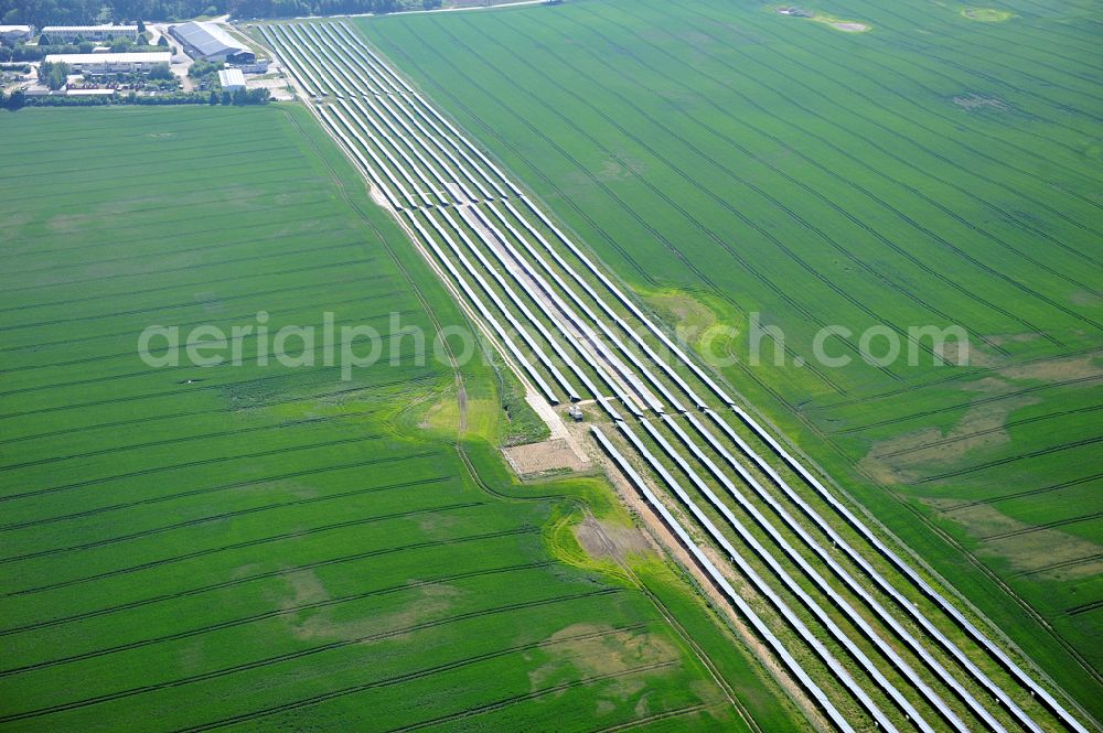 Dedelow from the bird's eye view: Solar power plant and photovoltaic systems on the former runway with the tarmac area of the airfield in Dedelow in the state Brandenburg, Germany