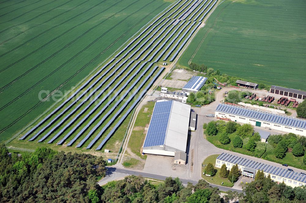 Aerial image Dedelow - Solar power plant and photovoltaic systems on the former runway with the tarmac area of the airfield in Dedelow in the state Brandenburg, Germany