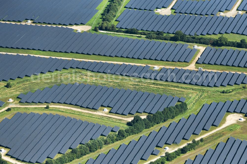 Aerial photograph Aalbek - Rows of panels of a solar power plant and photovoltaic system on a field in Aalbek in the state Schleswig-Holstein, Germany