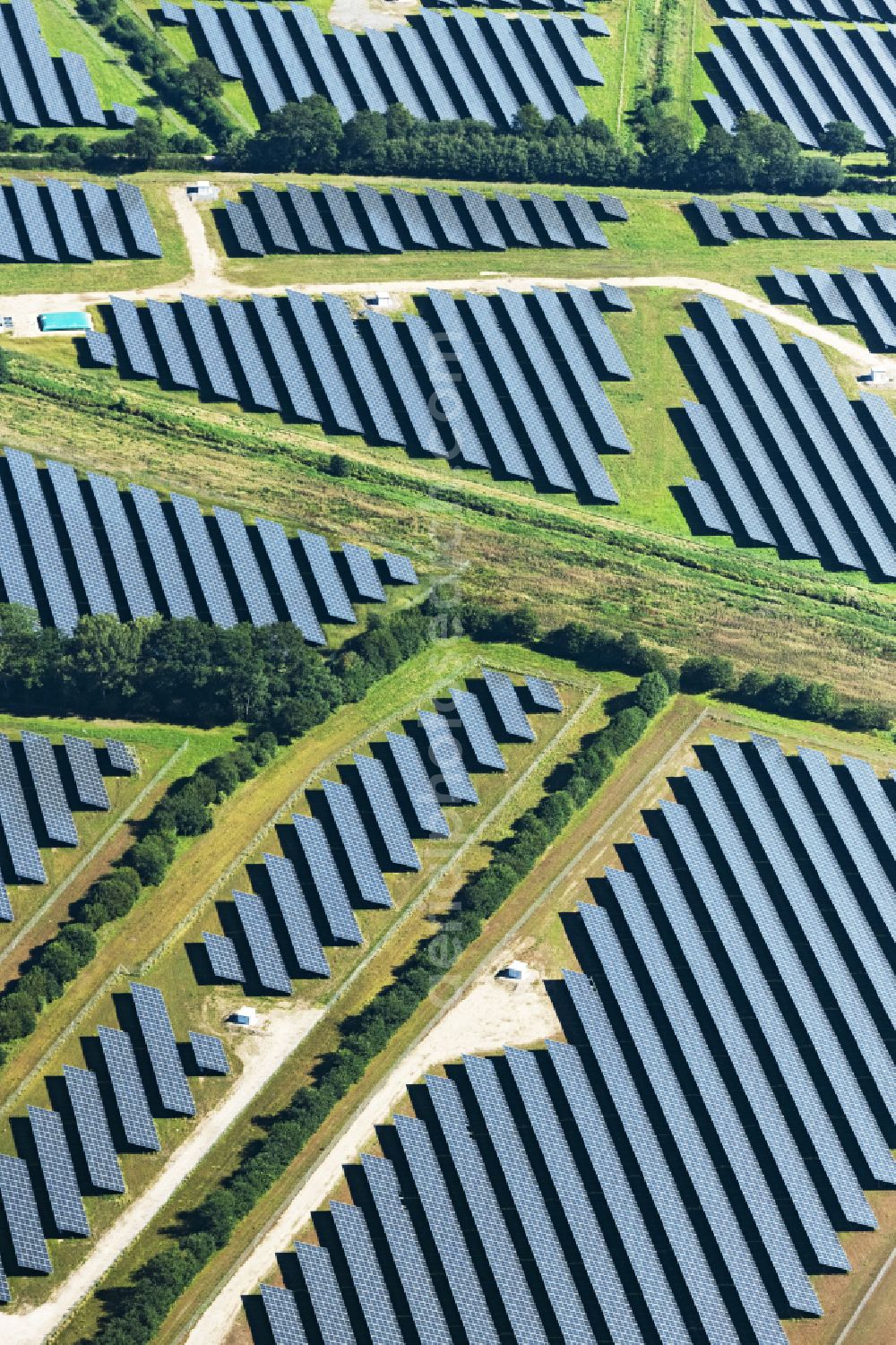 Aerial image Aalbek - Rows of panels of a solar power plant and photovoltaic system on a field in Aalbek in the state Schleswig-Holstein, Germany