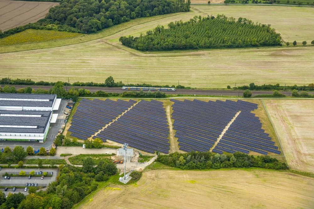 Aerial photograph Ahlen - Rows of panels of a solar power plant and photovoltaic system on a field on street Gersteinstrasse in Ahlen in the state North Rhine-Westphalia, Germany