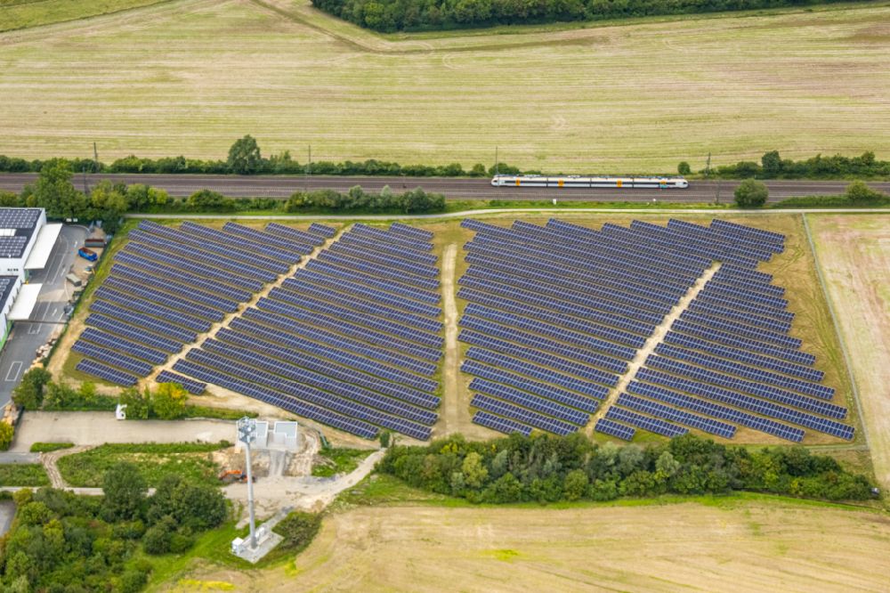 Ahlen from above - Rows of panels of a solar power plant and photovoltaic system on a field on street Gersteinstrasse in Ahlen in the state North Rhine-Westphalia, Germany