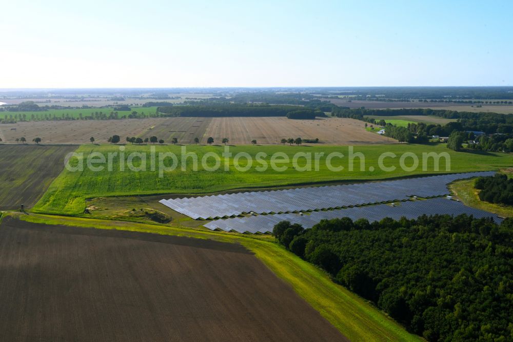 Aerial photograph Drechow - Rows of panels of a solar power plant and photovoltaic system on a field in Drechow in the state Mecklenburg - Western Pomerania, Germany