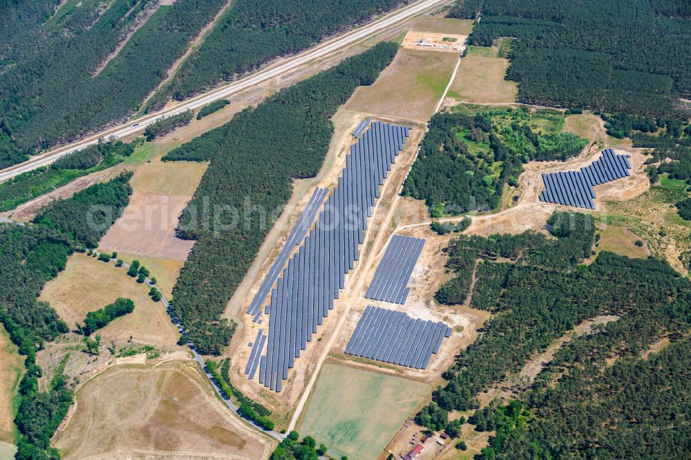 Aerial image Grabow - Rows of panels of a solar power plant and photovoltaic system on a field in Grabow in the state Mecklenburg - Western Pomerania, Germany