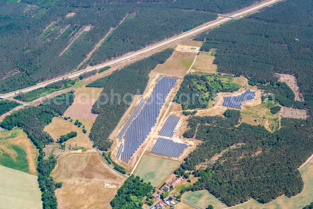 Aerial photograph Grabow - Rows of panels of a solar power plant and photovoltaic system on a field in Grabow in the state Mecklenburg - Western Pomerania, Germany