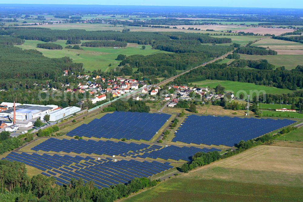 Grüneberg from the bird's eye view: Panel rows of a solar power plant and photovoltaic system on a field on Sandbergstrasse in Grueneberg Lowenberger Land in the state Brandenburg, Germany