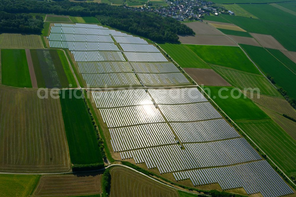 Richelbach from above - Rows of panels of a solar power plant and photovoltaic system on a field in Richelbach in the state Bavaria, Germany