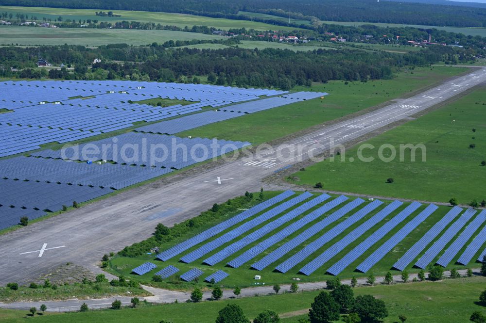 Werneuchen from above - Solar power plant and photovoltaic systems on the airfield on street Alte Hirschfelder Strasse in Werneuchen in the state Brandenburg, Germany
