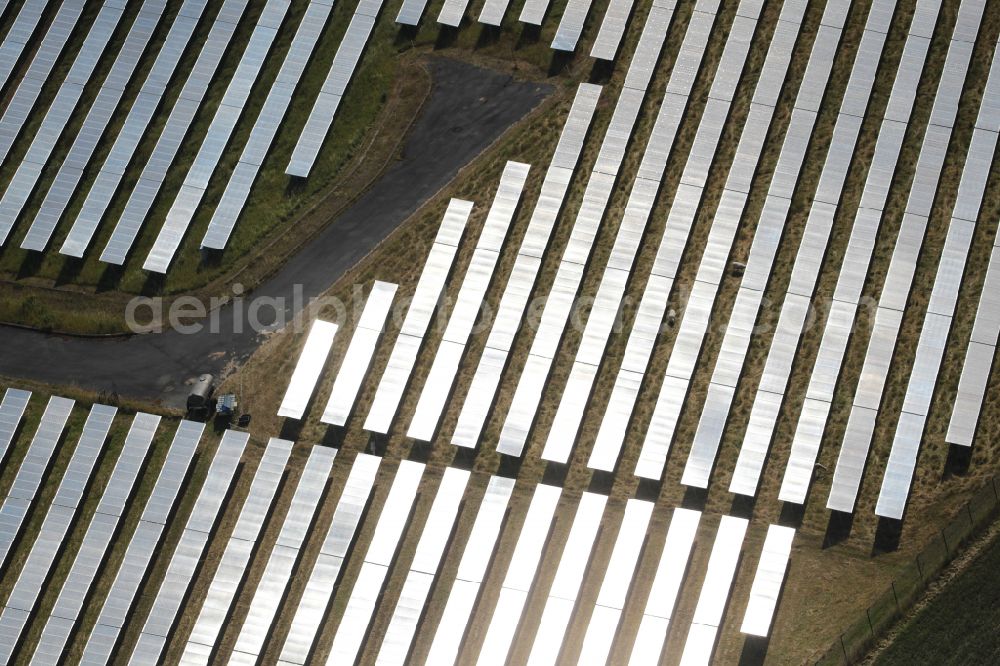 Aerial image Klettbach - Rows of panels of a solar power plant and photovoltaic system Solaranlage Meckfelder Strasse on a field on street Meckfelder Strasse in Klettbach in the state Thuringia, Germany