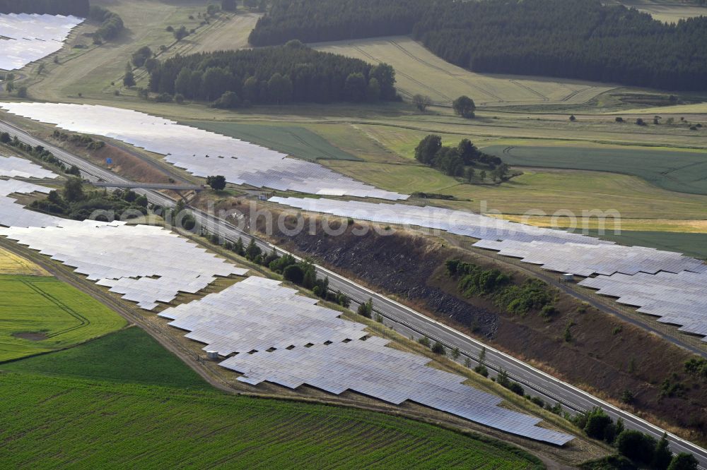 Aerial photograph Gattendorf - Photovoltaic system and solar power plant - rows of panels on the edge of the lanes of the motorway route and route of the BAB A 93 in Gattendorf in the state Bavaria, Germany