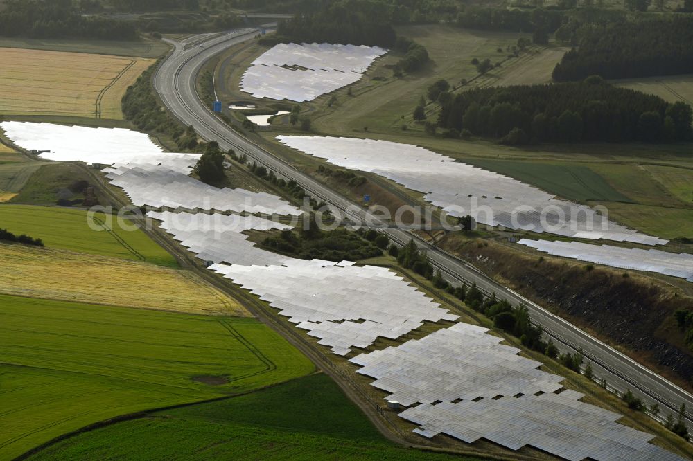 Gattendorf from above - Photovoltaic system and solar power plant - rows of panels on the edge of the lanes of the motorway route and route of the BAB A 93 in Gattendorf in the state Bavaria, Germany