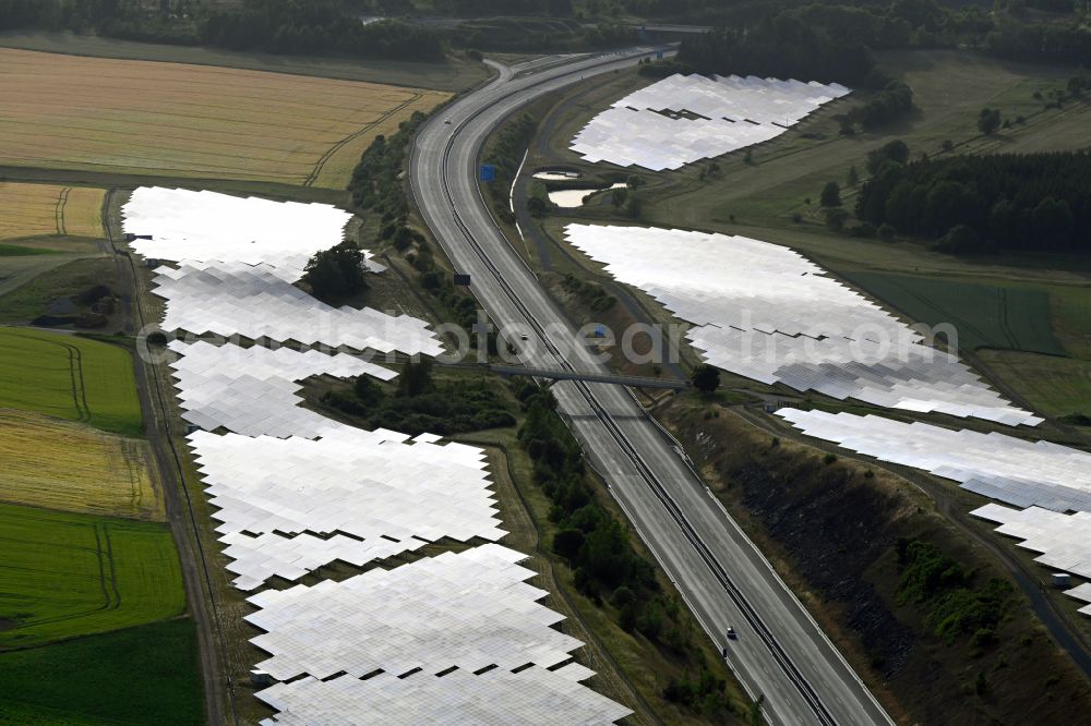 Aerial image Gattendorf - Photovoltaic system and solar power plant - rows of panels on the edge of the lanes of the motorway route and route of the BAB A 93 in Gattendorf in the state Bavaria, Germany