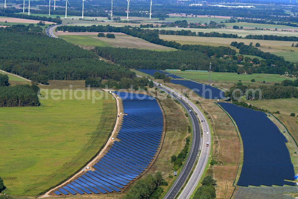 Maulbeerwalde from above - Photovoltaic system and solar power plant - rows of panels on the edge of the lanes of the motorway route and route of the BAB A 24 in Maulbeerwalde in the state Brandenburg, Germany