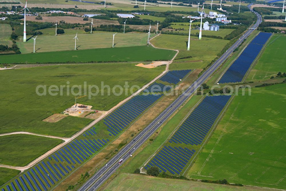 Maulbeerwalde from above - Photovoltaic system and solar power plant - rows of panels on the edge of the lanes of the motorway route and route of the BAB A 24 in Maulbeerwalde in the state Brandenburg, Germany