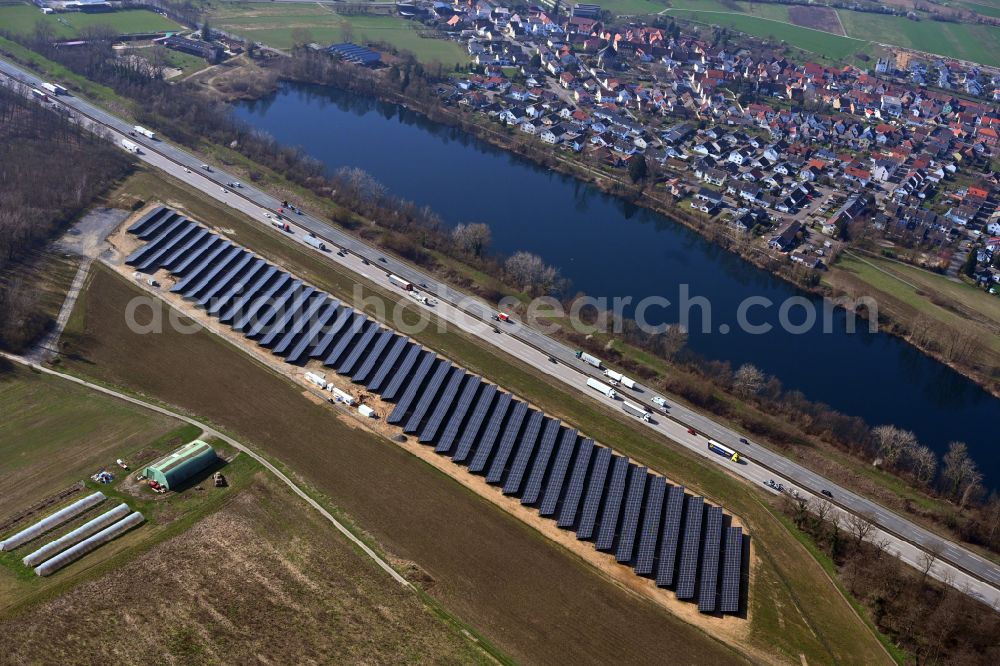 Untergrombach from above - Photovoltaic system and solar power plant - rows of panels on the edge of the lanes of the motorway route and route of the BAB A in Untergrombach in the state Baden-Wuerttemberg, Germany