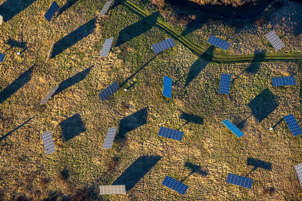 Bottrop from the bird's eye view: Panel rows of photovoltaic and solar farm at Suedring in Bottrop in the state North Rhine-Westphalia