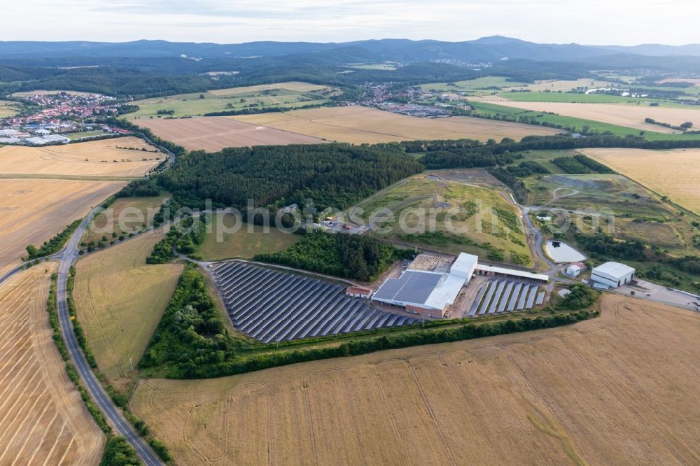Aerial image Leinatal - Panel rows of photovoltaic and solar farm or solar power plant on an old landfill of Kommunaler Abfallservice of Landkreises Gotha in Leinatal in the state Thuringia, Germany