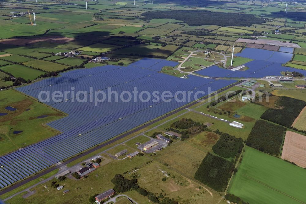 Aerial photograph Eggebek - Panel rows of photovoltaic and solar farm or solar power plant of the company Moehring Energie GmbH and mainova AG in Eggebek in the state Schleswig-Holstein