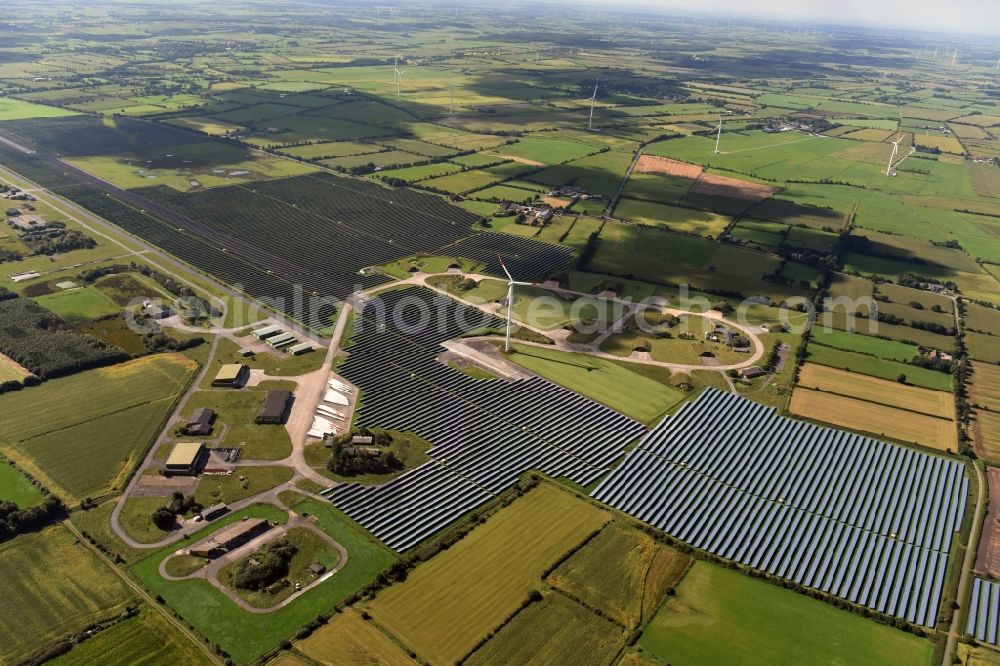 Aerial photograph Eggebek - Panel rows of photovoltaic and solar farm or solar power plant of the company Moehring Energie GmbH and mainova AG in Eggebek in the state Schleswig-Holstein