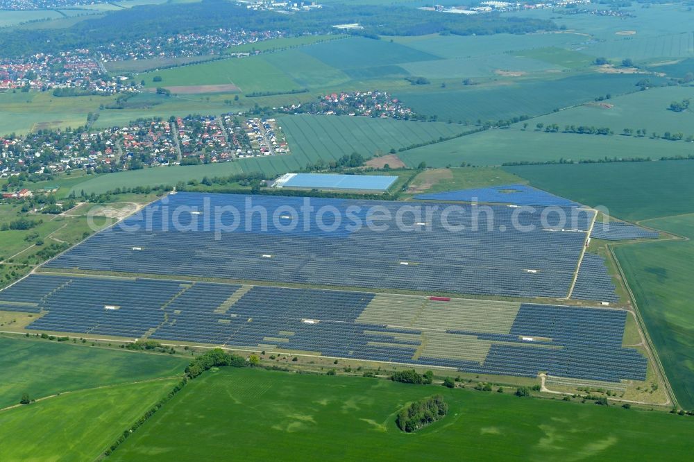 Aerial photograph Eiche - Panel rows of photovoltaic and solar farm or solar power plant on fields in Eiche in the state Brandenburg, Germany