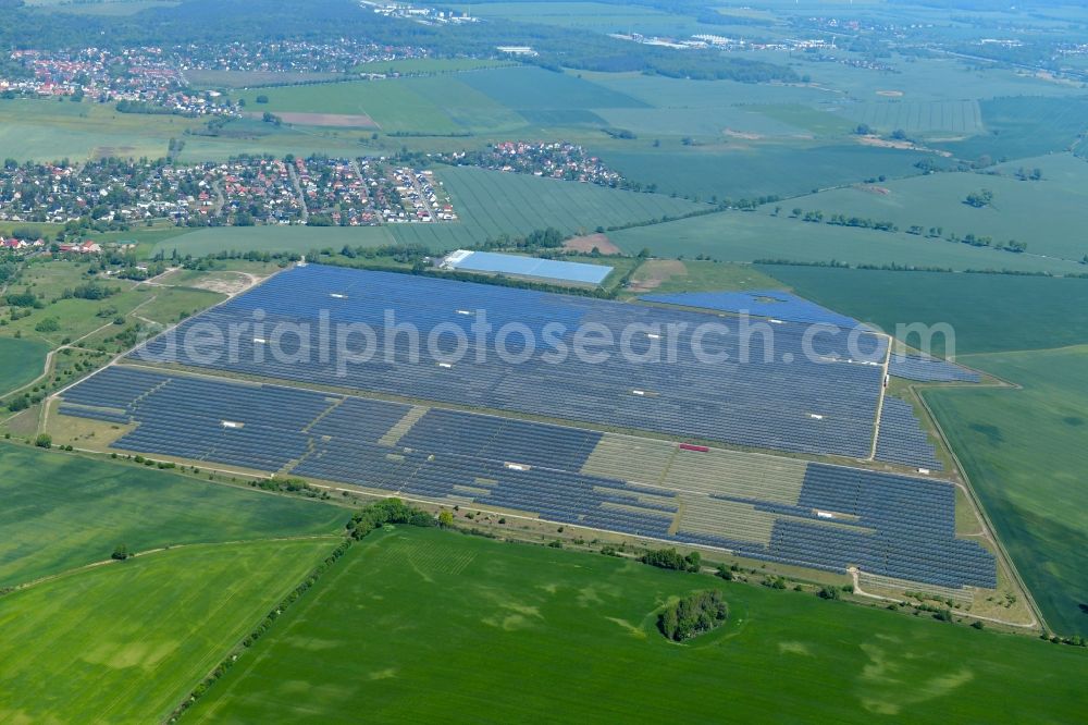 Eiche from above - Panel rows of photovoltaic and solar farm or solar power plant on fields in Eiche in the state Brandenburg, Germany