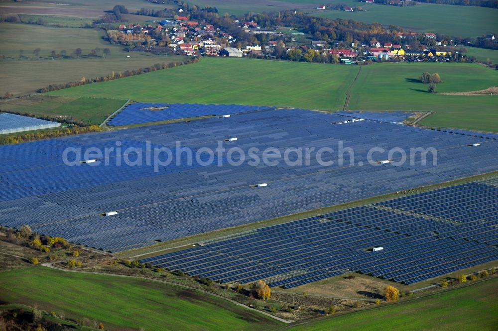 Eiche from the bird's eye view: Panel rows of photovoltaic and solar farm or solar power plant on fields in Eiche in the state Brandenburg, Germany