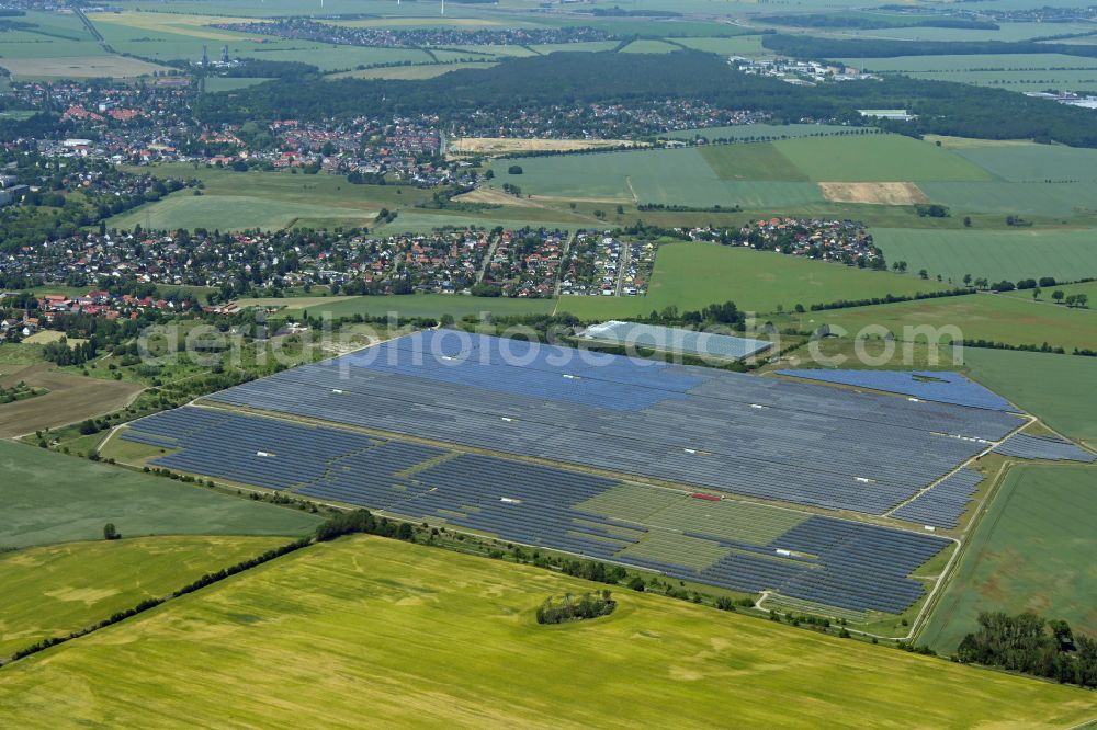 Aerial photograph Eiche - Panel rows of photovoltaic and solar farm or solar power plant on fields in Eiche in the state Brandenburg, Germany
