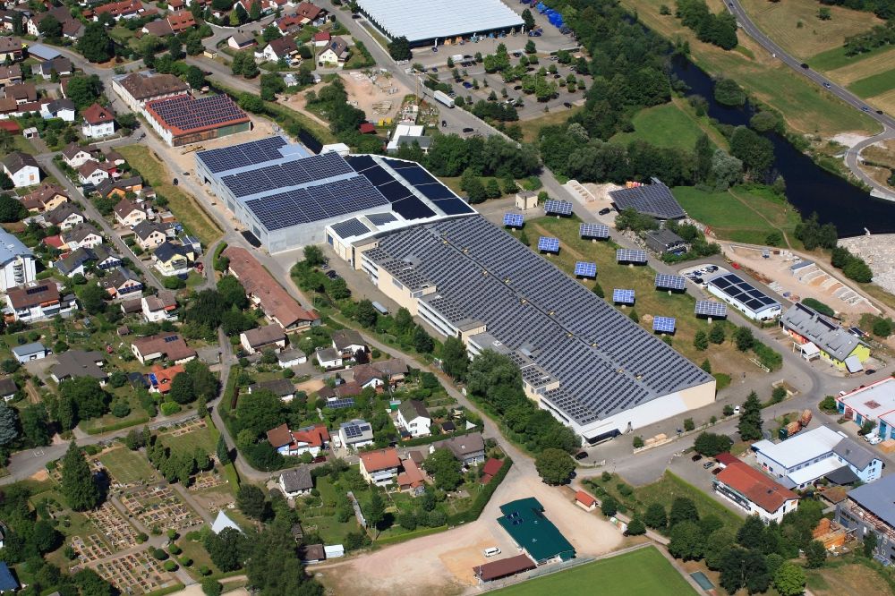 Hausen im Wiesental from above - Panel rows of photovoltaic and solar farm or solar power plant on the company's roof and roof areas of the former textile company Brennet AG in Hausen im Wiesental in the state Baden-Wuerttemberg