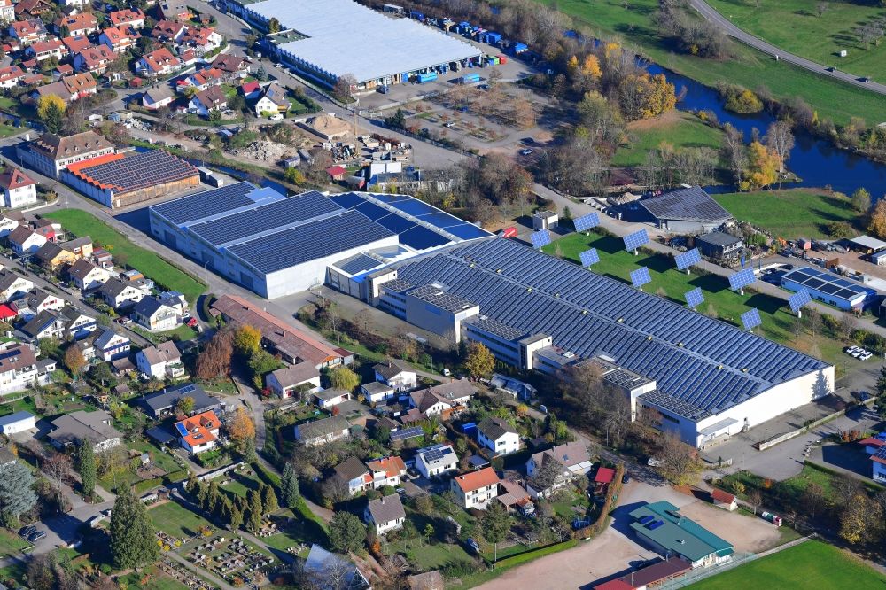 Aerial image Hausen im Wiesental - Panel rows of photovoltaic and solar farm or solar power plant on the company's roof and roof areas of the former textile company Brennet AG in Hausen im Wiesental in the state Baden-Wurttemberg